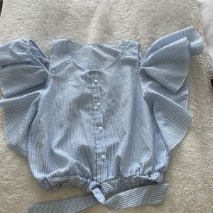 Blue and white striped top.